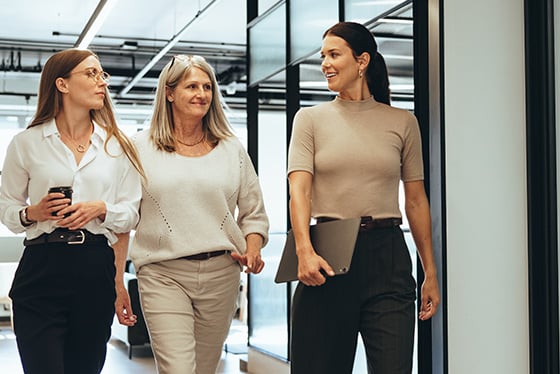 professionals talking and walking at work