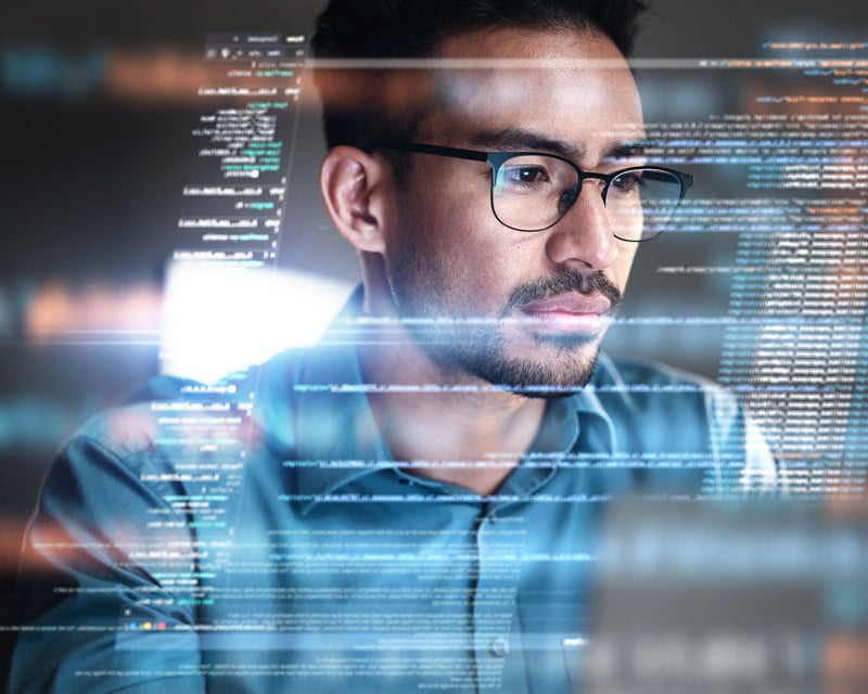 A programmer working on a computer.