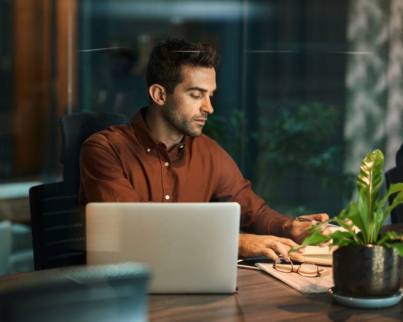A man working at a home office.