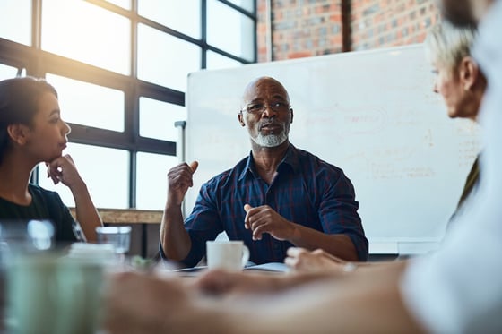 A business professional conducting a meeting, supported by IT security services to ensure secure communications.
