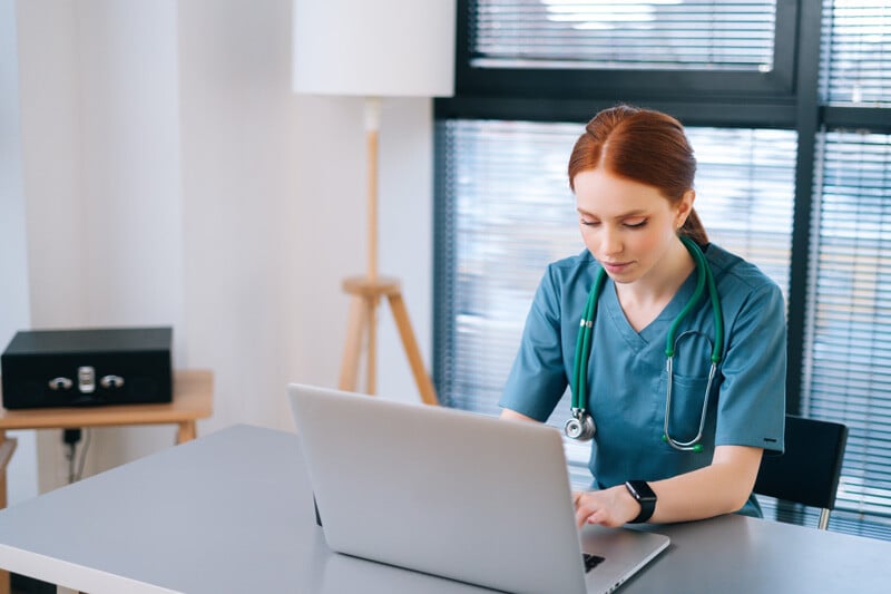 healthcare professional working at computer